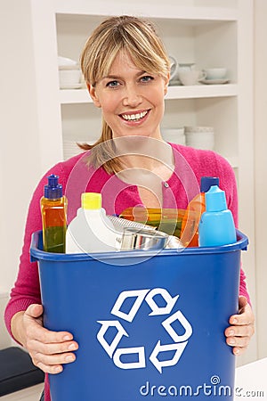 Woman Holding Recyling Waste Bin At Home Stock Photo