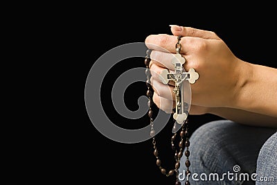 Woman holding rosary. Stock Photo