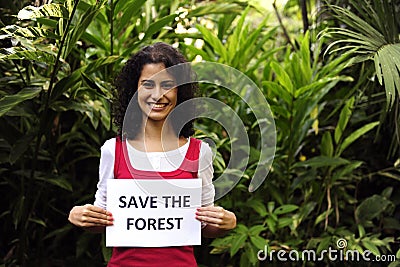 Woman holding a save the forest sign Stock Photo