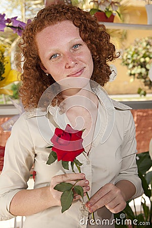 Woman holding a single rose Stock Photo