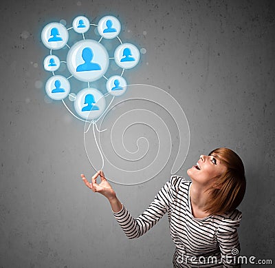 Woman holding social network balloon Stock Photo