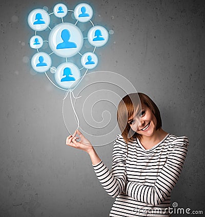 Woman holding social network balloon Stock Photo