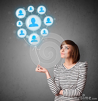 Woman holding social network balloon Stock Photo