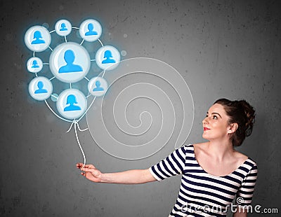 Woman holding social network balloon Stock Photo