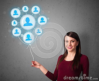 Woman holding social network balloon Stock Photo