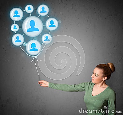 Woman holding social network balloon Stock Photo