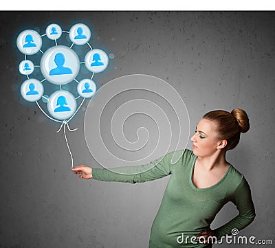 Woman holding social network balloon Stock Photo