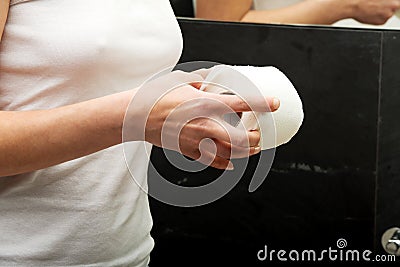 Woman holding toilet paper. Stock Photo