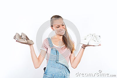Woman holding two pairs of shoes Stock Photo