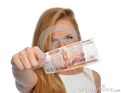 Woman holding up cash money five thousand russian rubles note in Stock Photo