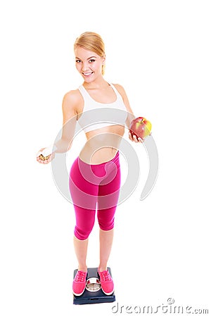 Woman holding vitamins and apple. Health care. Stock Photo