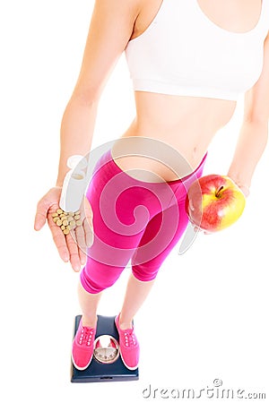 Woman holding vitamins and apple. Health care. Stock Photo