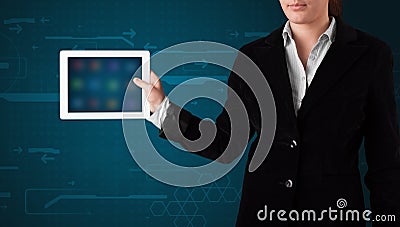 Woman holding a white tablet with blurry apps Stock Photo