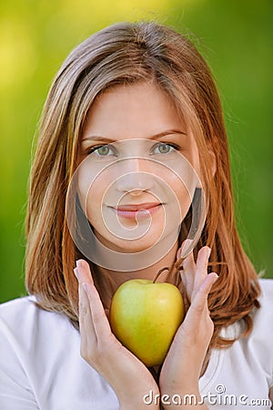 Woman holds apple Stock Photo