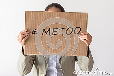 A woman holds a banner with the inscription METOO Stock Photo