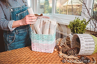 Woman holds basket with sets for basketmaker Stock Photo