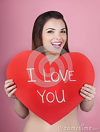 Woman holds big red heart i love you in her hands Stock Photo