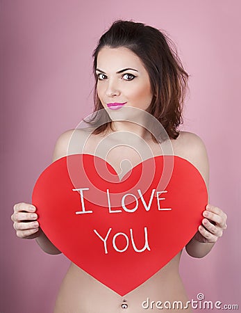 Woman holds big red heart i love you in her hands Stock Photo