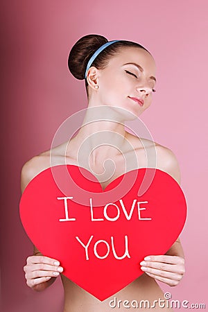 woman holds big red heart i love you in her hands Stock Photo