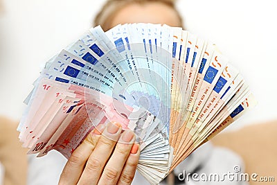 Woman holds euro money banknotes Stock Photo