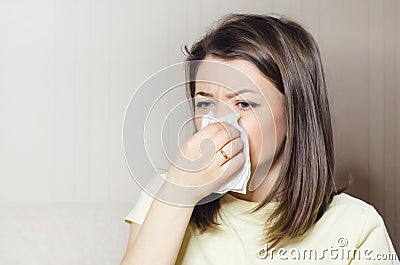 Woman holds handkerchief, napkin in her hand. runny nose, common cold, virus Stock Photo