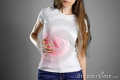 A woman holds the liver. Pain in the abdomen. Cirrhosis of the l Stock Photo