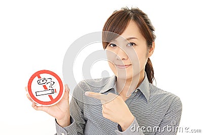 Woman holds non smoking sign Stock Photo