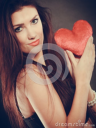 Woman holds red heart love symbol Stock Photo