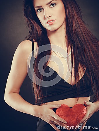 Woman holds red heart love symbol Stock Photo