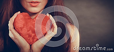 Woman holds red heart love symbol Stock Photo