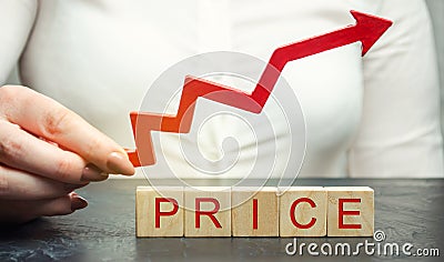 A woman holds a red up arrow above the wooden blocks and the inscription Price. Growing market value. Pricing. Market economy. Stock Photo