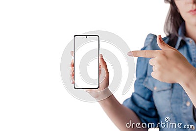 Woman holds and show a smart phone with a pointed finger Stock Photo