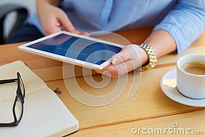 Woman holds a tablet with online banking Stock Photo