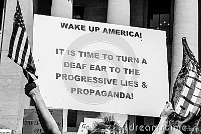 A Woman Holds a Sign Reading `Wake Up America` at a Conservative Rally Editorial Stock Photo
