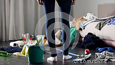 Woman horrified by mess left after party in her apartment, cleaning service Stock Photo