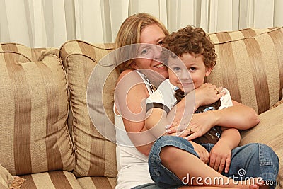 Woman hugging child Stock Photo