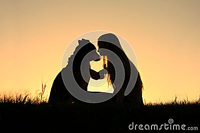 Woman Hugging Dog Silhouette Stock Photo