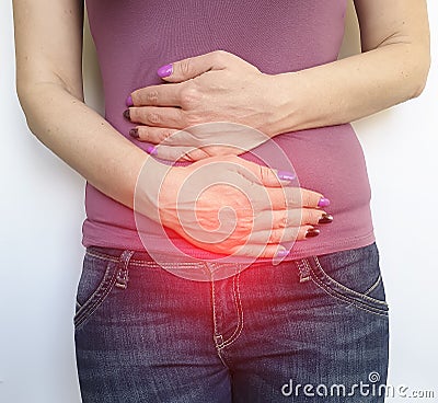 Woman hurts her intestine, syndrome, abdominal digestion stomach Stock Photo