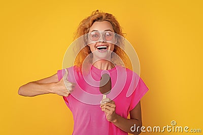 woman with icelolly ice cream in studio, thumb up. woman with icelolly ice cream Stock Photo