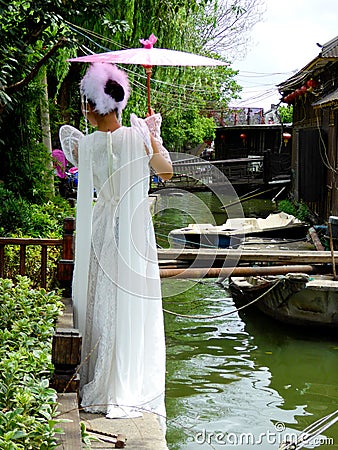 Woman inside Xitang ancient town Editorial Stock Photo