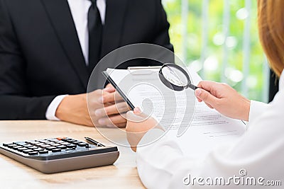 Woman inspects approved loan contract with bank seller. Stock Photo