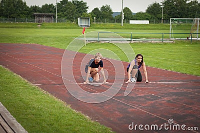 Woman jogging outdoor on a racecourse Stock Photo