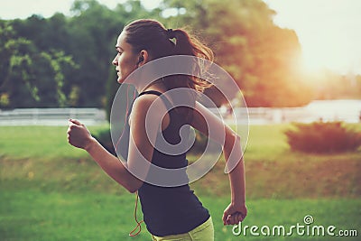 Woman jogging at park Stock Photo