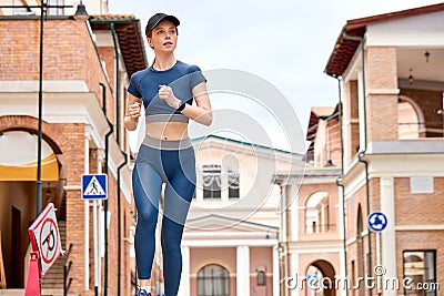 Woman is jogging, running. Motivation heatlhy fit living. Healthy pretty female run. Stock Photo