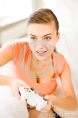 Woman with joystick playing video games Stock Photo