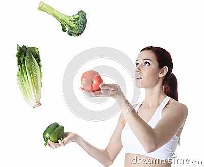 Woman juggle vegetable Stock Photo