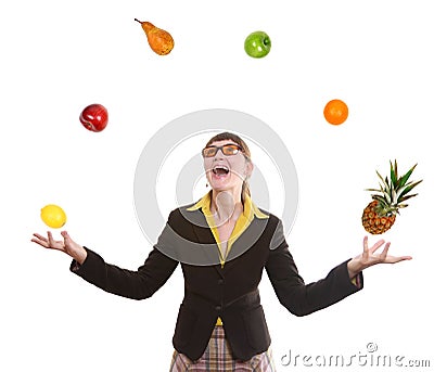 Woman juggling fruit Stock Photo