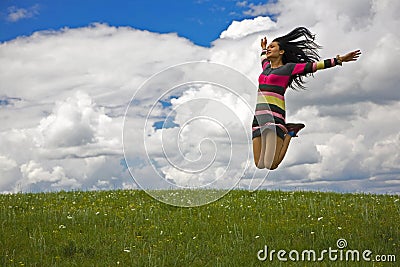 Woman Jumping for Joy Stock Photo