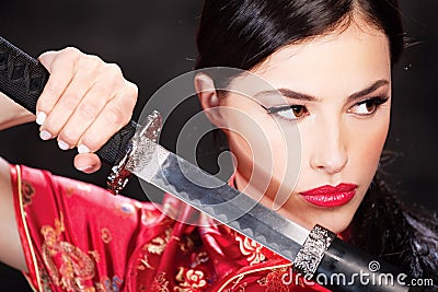 Woman and katana / sword Stock Photo