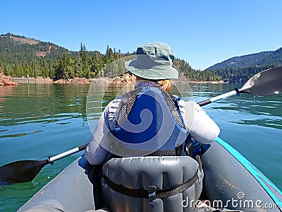Woman Kayaks in Lost Creek Lake, Oregon Stock Photo